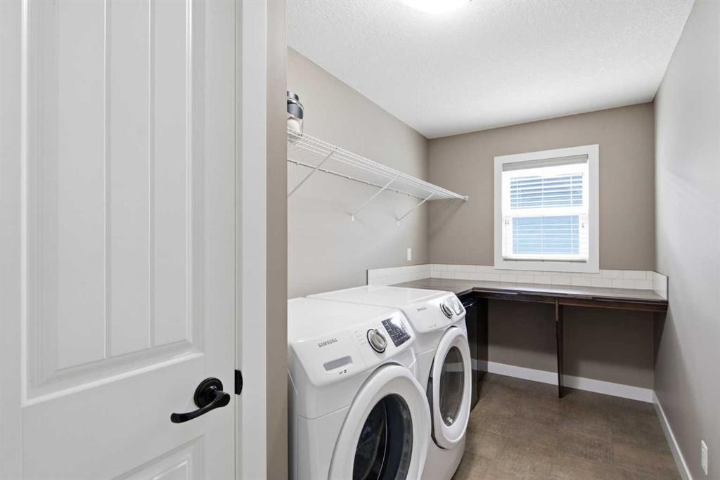 300 Aspenmere Way, Chestermere, AB - Indoor Photo Showing Laundry Room