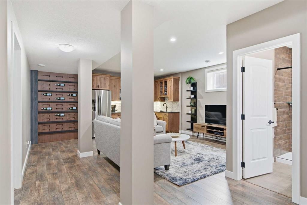 300 Aspenmere Way, Chestermere, AB - Indoor Photo Showing Other Room With Fireplace