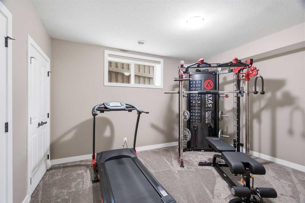300 Aspenmere Way, Chestermere, AB - Indoor Photo Showing Gym Room