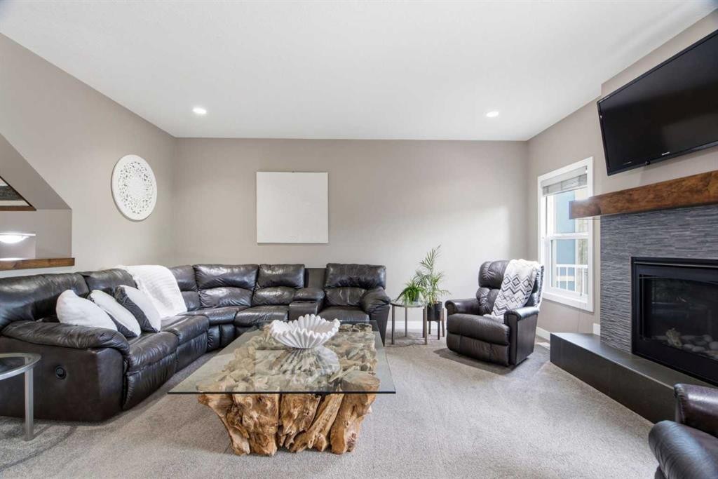 300 Aspenmere Way, Chestermere, AB - Indoor Photo Showing Living Room With Fireplace