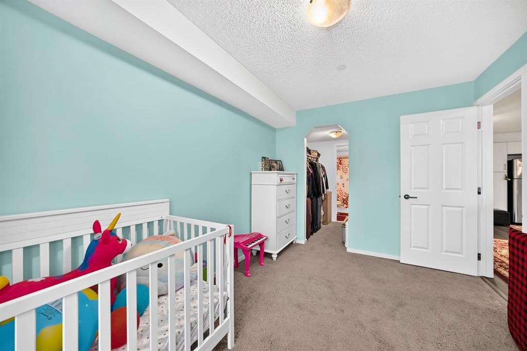 4310-755 Copperpond Boulevard Se, Calgary, AB - Indoor Photo Showing Bedroom