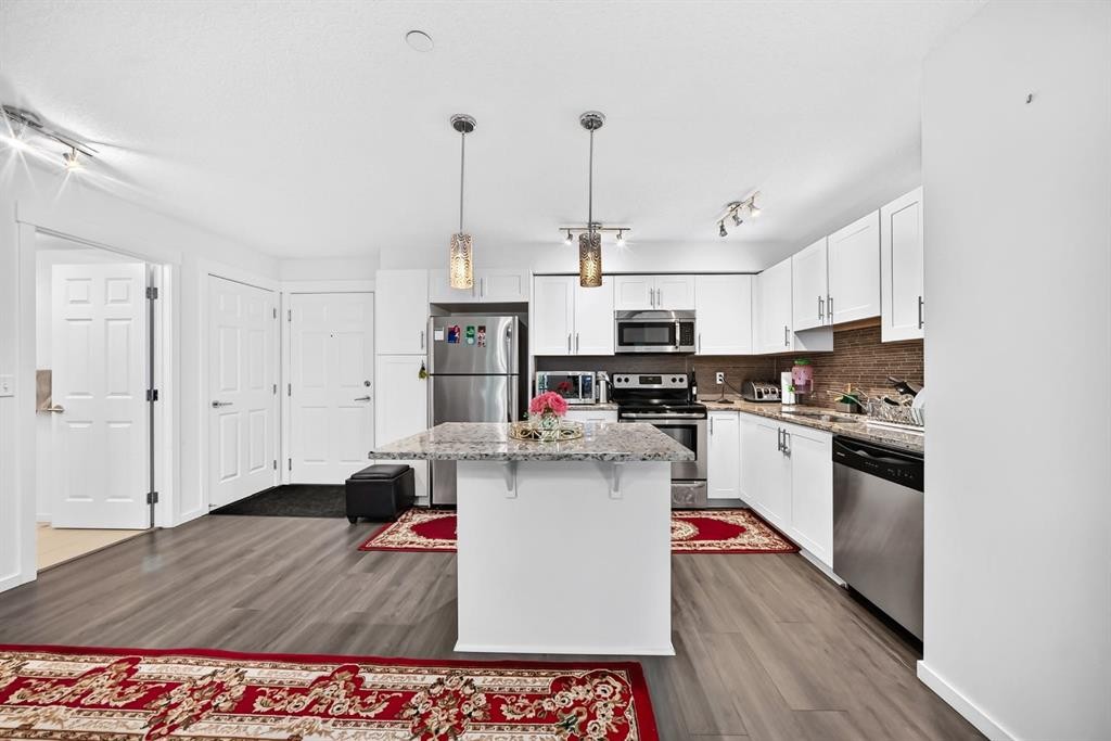 4310-755 Copperpond Boulevard Se, Calgary, AB - Indoor Photo Showing Kitchen With Upgraded Kitchen