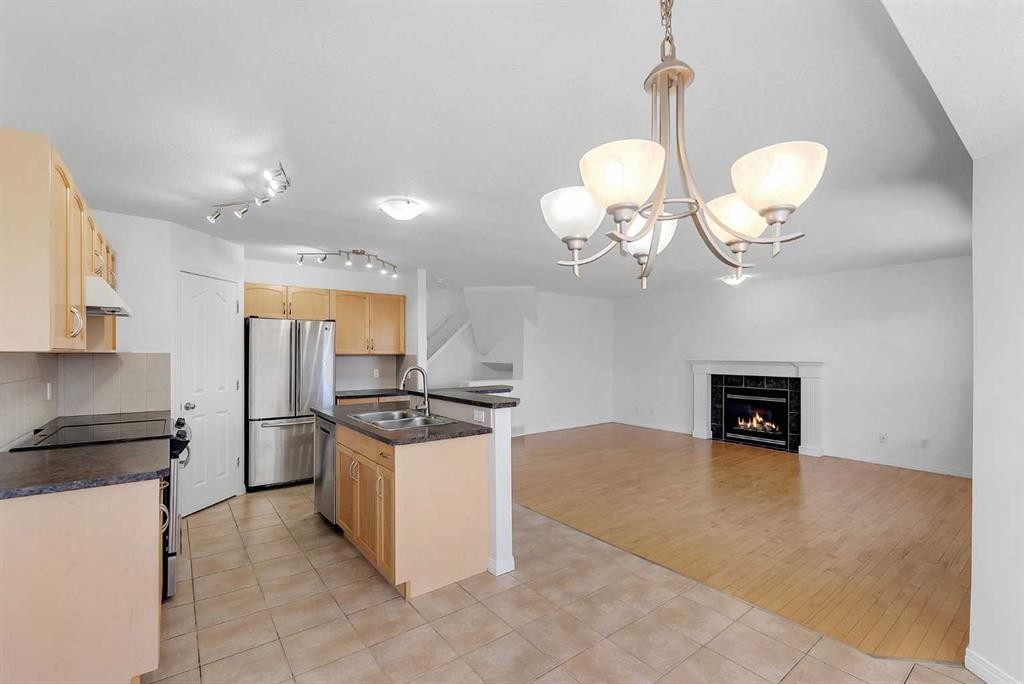 7 Saddlecrest Terrace Ne, Calgary, AB - Indoor Photo Showing Kitchen With Double Sink