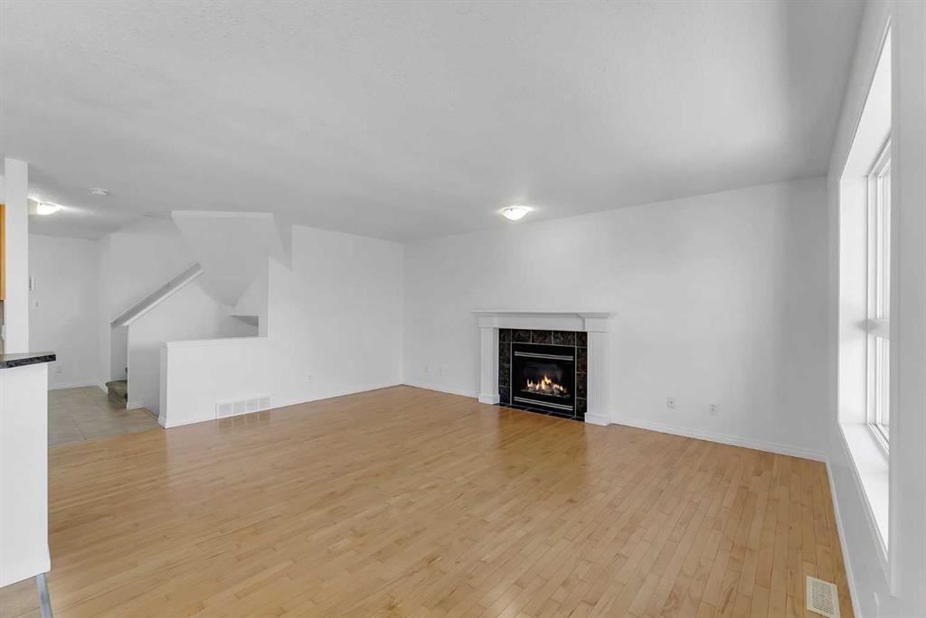 7 Saddlecrest Terrace Ne, Calgary, AB - Indoor Photo Showing Living Room With Fireplace