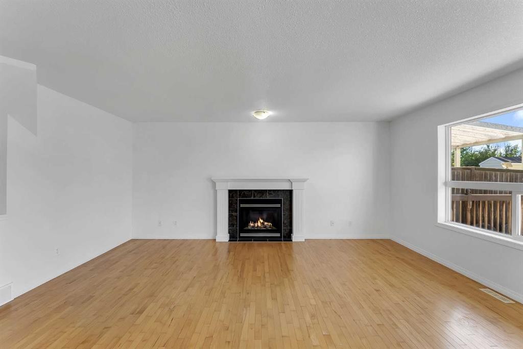 7 Saddlecrest Terrace Ne, Calgary, AB - Indoor Photo Showing Living Room With Fireplace