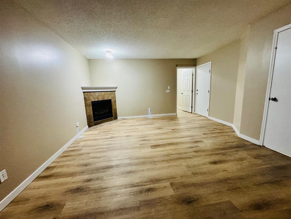 184 Taralake Terrace Ne, Calgary, AB - Indoor Photo Showing Other Room With Fireplace