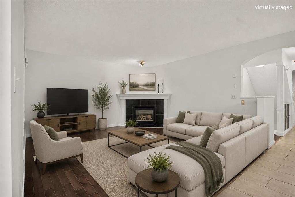 338 Panamount Drive Nw, Calgary, AB - Indoor Photo Showing Living Room With Fireplace