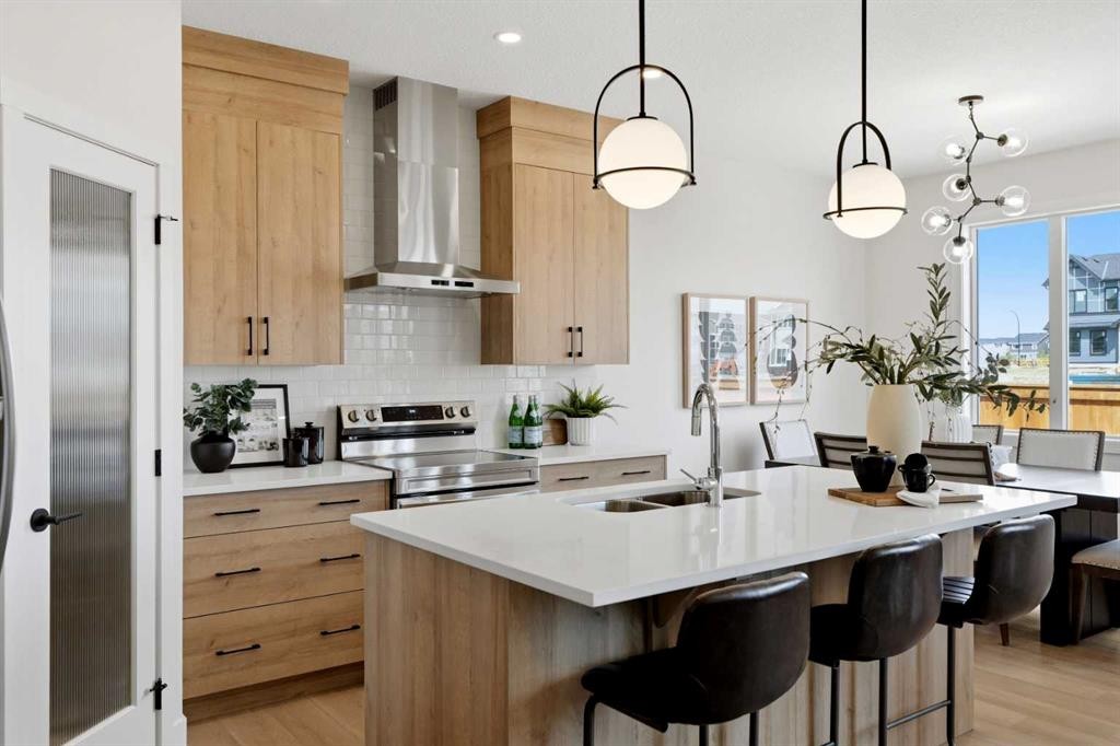 695 Buffaloberry Manor Se, Calgary, AB - Indoor Photo Showing Kitchen With Double Sink With Upgraded Kitchen