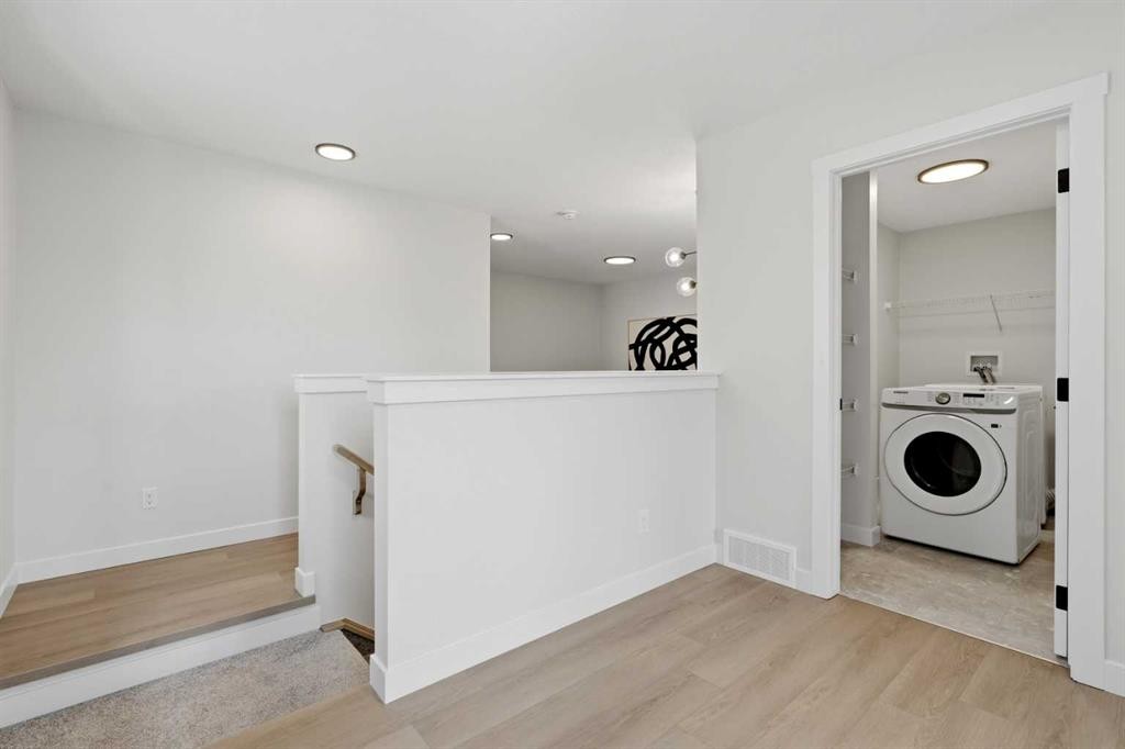 695 Buffaloberry Manor Se, Calgary, AB - Indoor Photo Showing Laundry Room