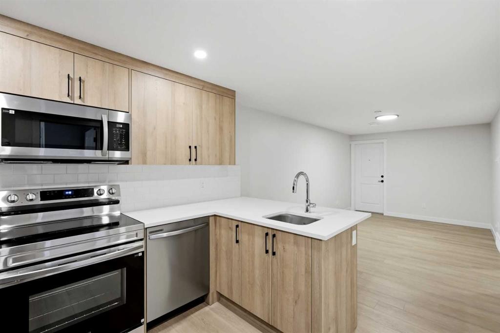 695 Buffaloberry Manor Se, Calgary, AB - Indoor Photo Showing Kitchen With Stainless Steel Kitchen