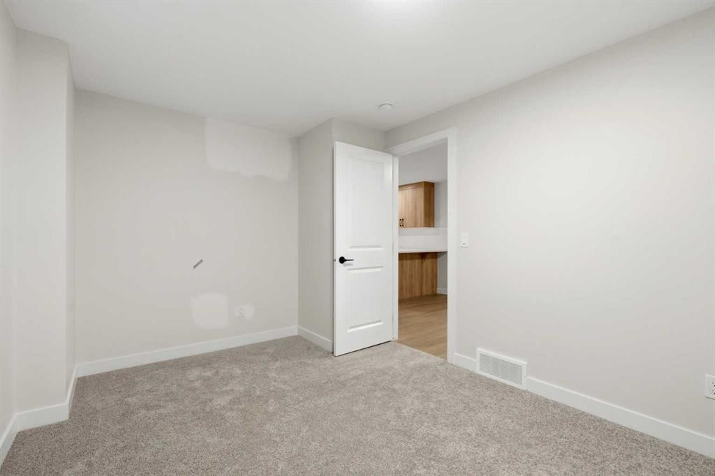 695 Buffaloberry Manor Se, Calgary, AB - Indoor Photo Showing Other Room
