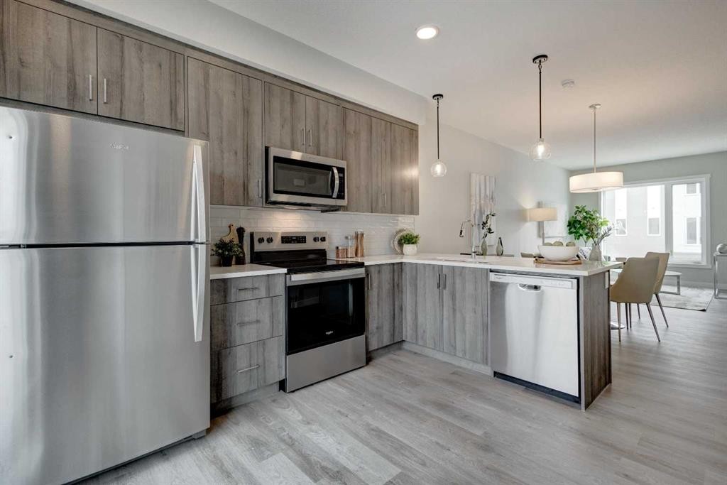 212 Shawnee Square Sw, Calgary, AB - Indoor Photo Showing Kitchen With Stainless Steel Kitchen With Upgraded Kitchen