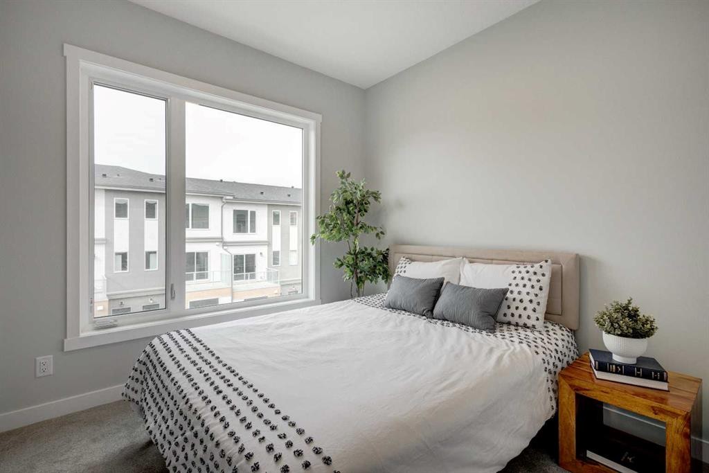 212 Shawnee Square Sw, Calgary, AB - Indoor Photo Showing Bedroom