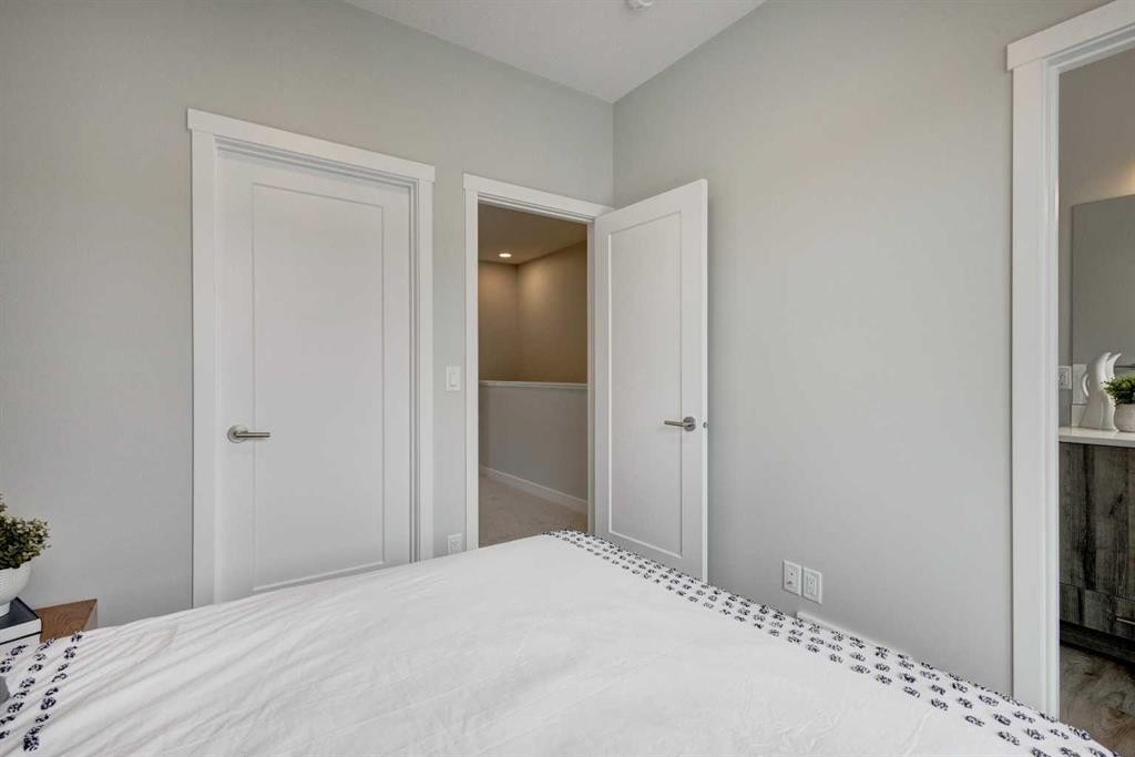 212 Shawnee Square Sw, Calgary, AB - Indoor Photo Showing Bedroom