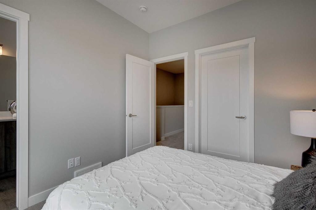 212 Shawnee Square Sw, Calgary, AB - Indoor Photo Showing Bedroom