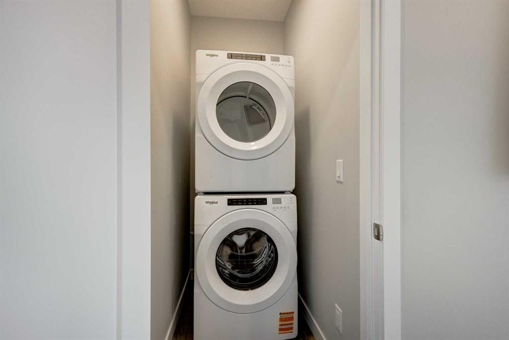 212 Shawnee Square Sw, Calgary, AB - Indoor Photo Showing Laundry Room