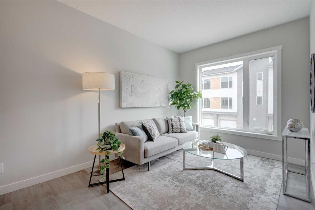 212 Shawnee Square Sw, Calgary, AB - Indoor Photo Showing Living Room
