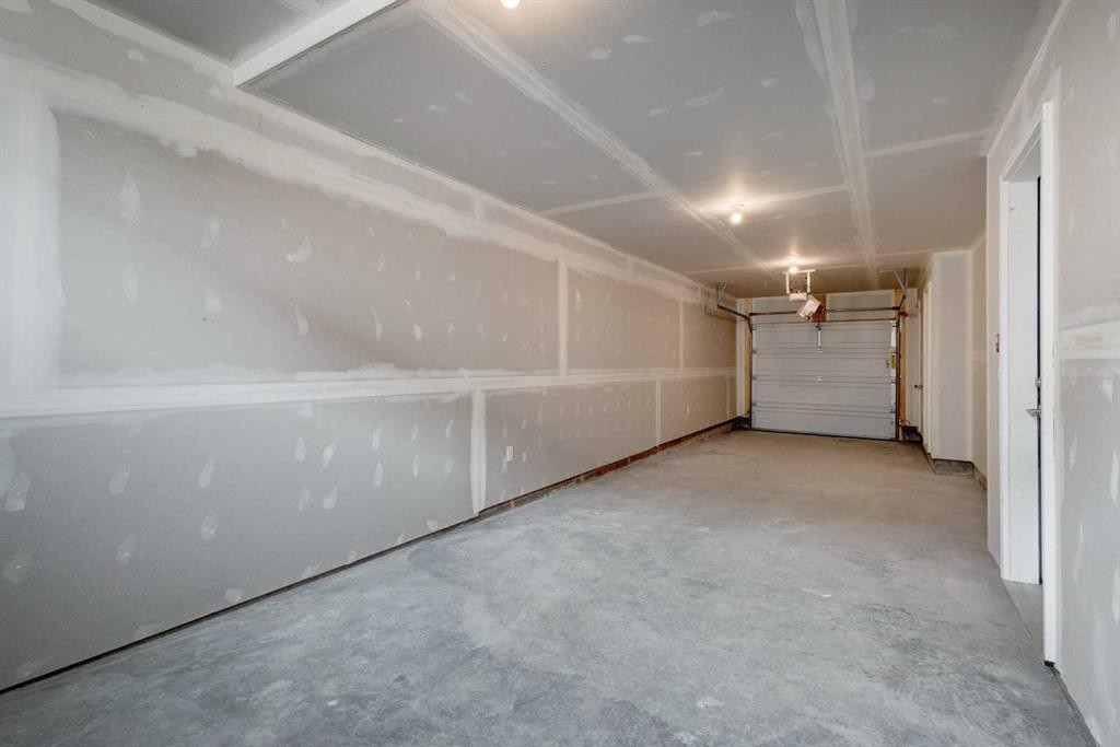 212 Shawnee Square Sw, Calgary, AB - Indoor Photo Showing Garage