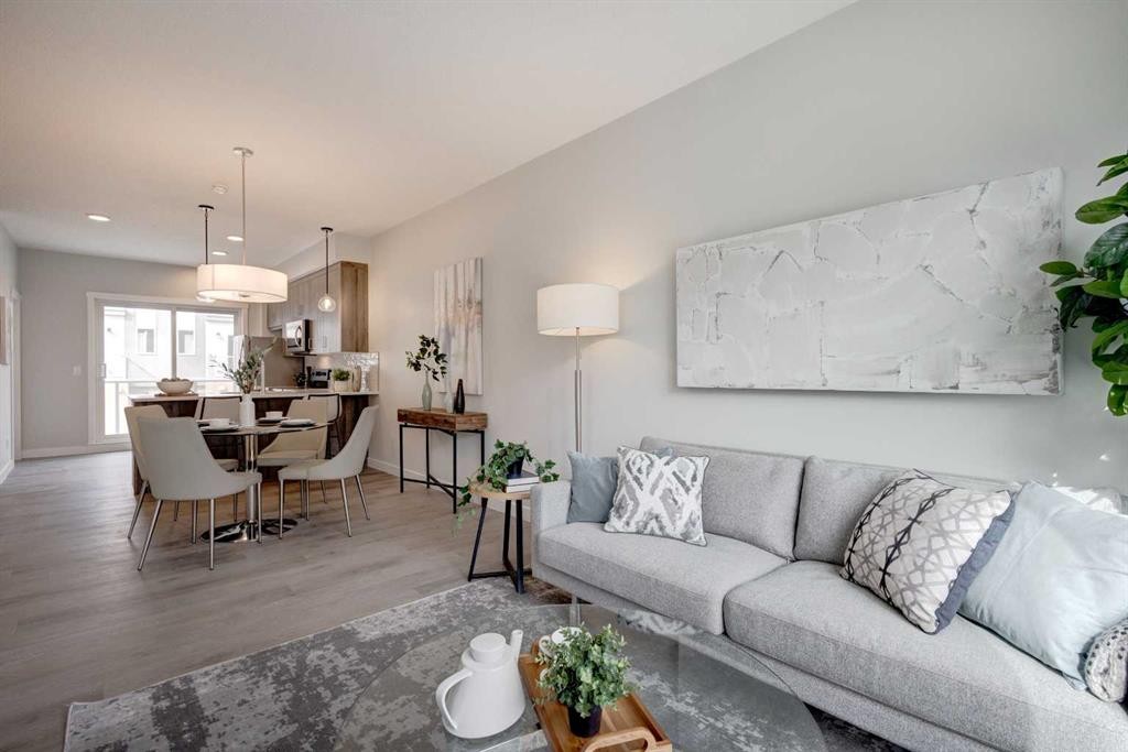 212 Shawnee Square Sw, Calgary, AB - Indoor Photo Showing Living Room