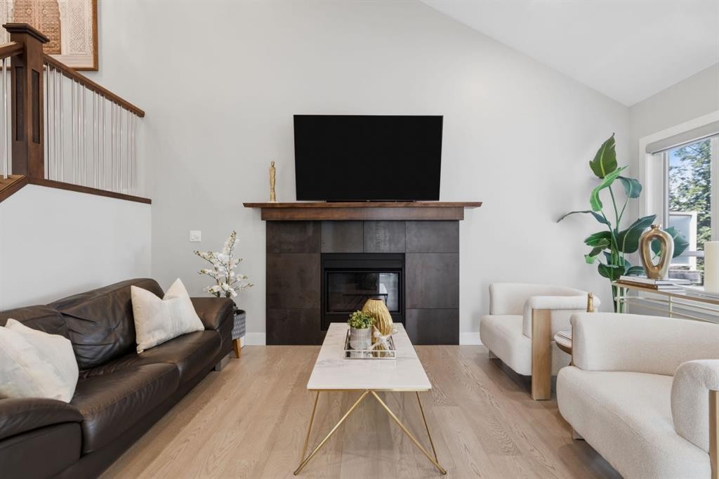 30 Strathcona Road Sw, Calgary, AB - Indoor Photo Showing Living Room With Fireplace