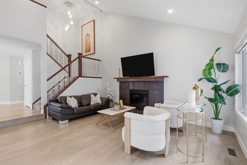 30 Strathcona Road Sw, Calgary, AB - Indoor Photo Showing Living Room With Fireplace
