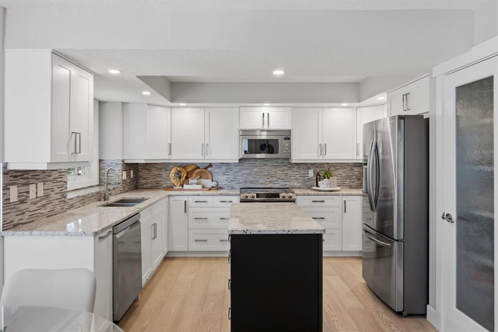 30 Strathcona Road Sw, Calgary, AB - Indoor Photo Showing Kitchen With Stainless Steel Kitchen With Double Sink With Upgraded Kitchen
