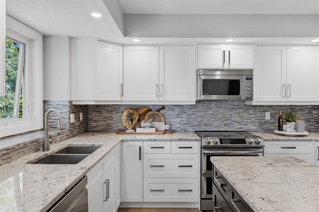 30 Strathcona Road Sw, Calgary, AB - Indoor Photo Showing Kitchen With Double Sink With Upgraded Kitchen