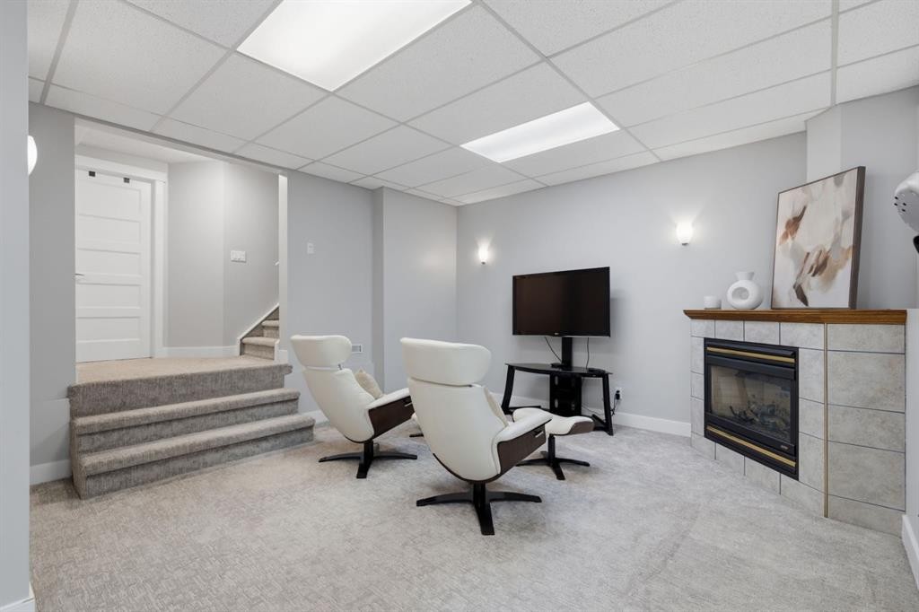 30 Strathcona Road Sw, Calgary, AB - Indoor With Fireplace