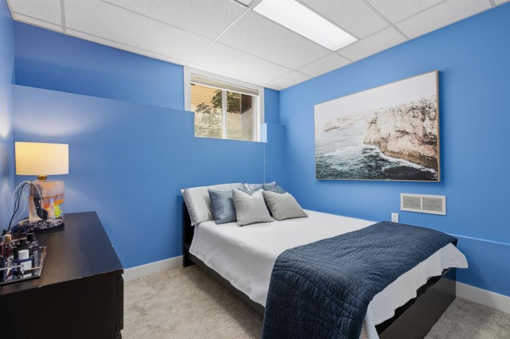 30 Strathcona Road Sw, Calgary, AB - Indoor Photo Showing Bedroom