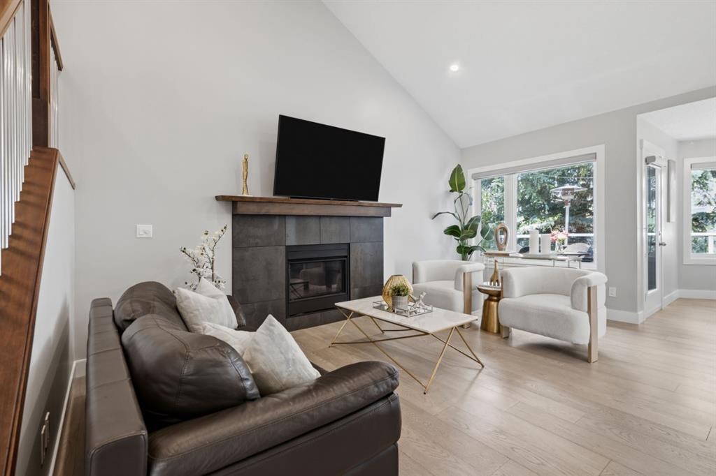 30 Strathcona Road Sw, Calgary, AB - Indoor Photo Showing Living Room With Fireplace
