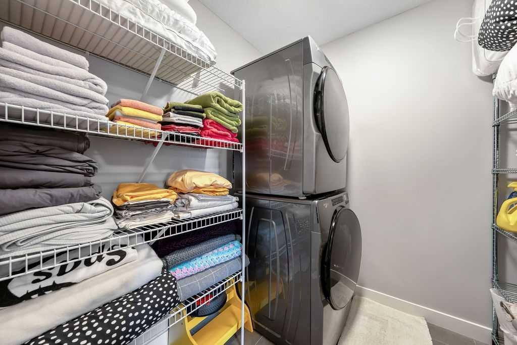 869 Cranston Avenue Se, Calgary, AB - Indoor Photo Showing Laundry Room