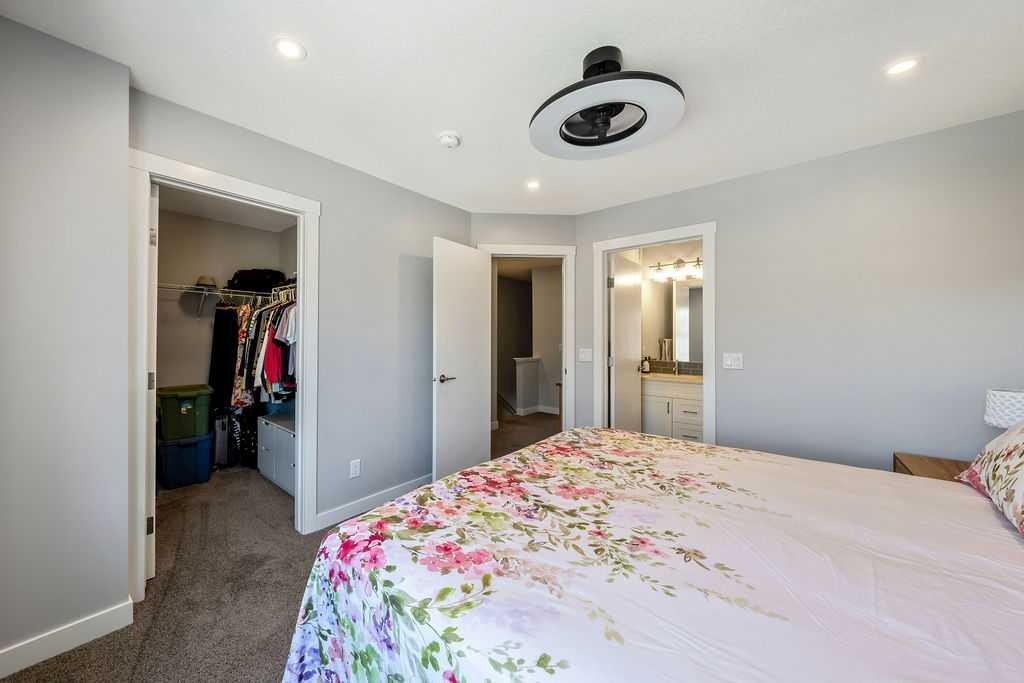 869 Cranston Avenue Se, Calgary, AB - Indoor Photo Showing Bedroom