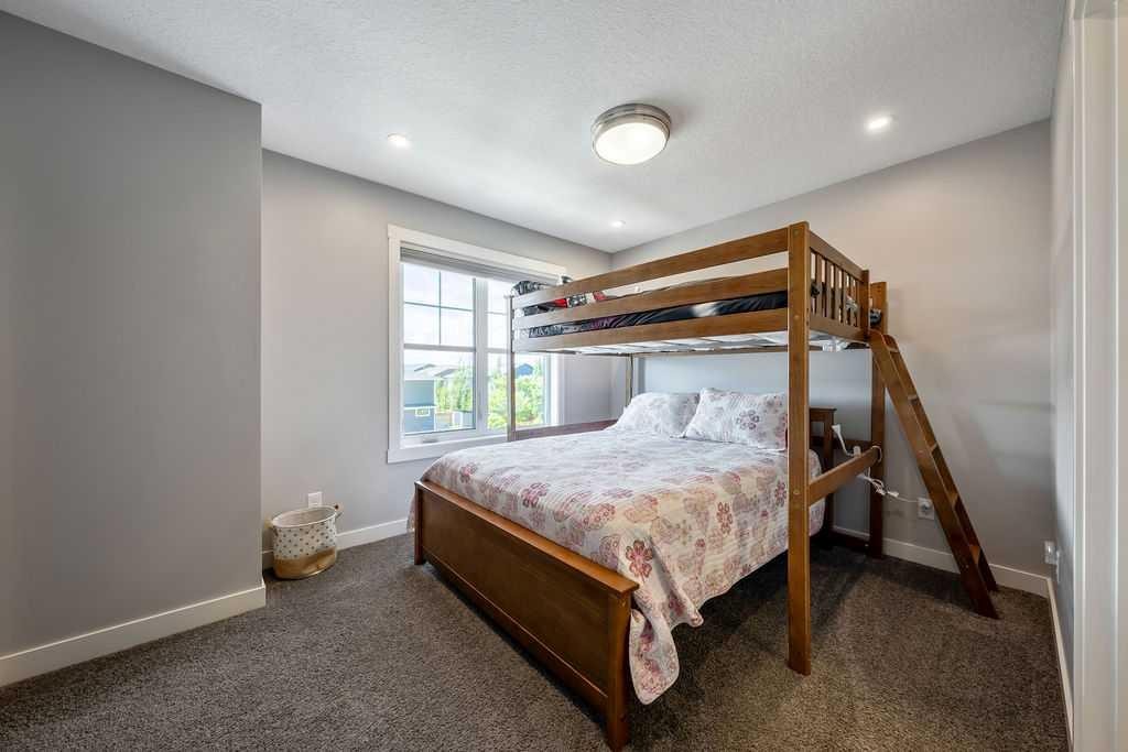 869 Cranston Avenue Se, Calgary, AB - Indoor Photo Showing Bedroom