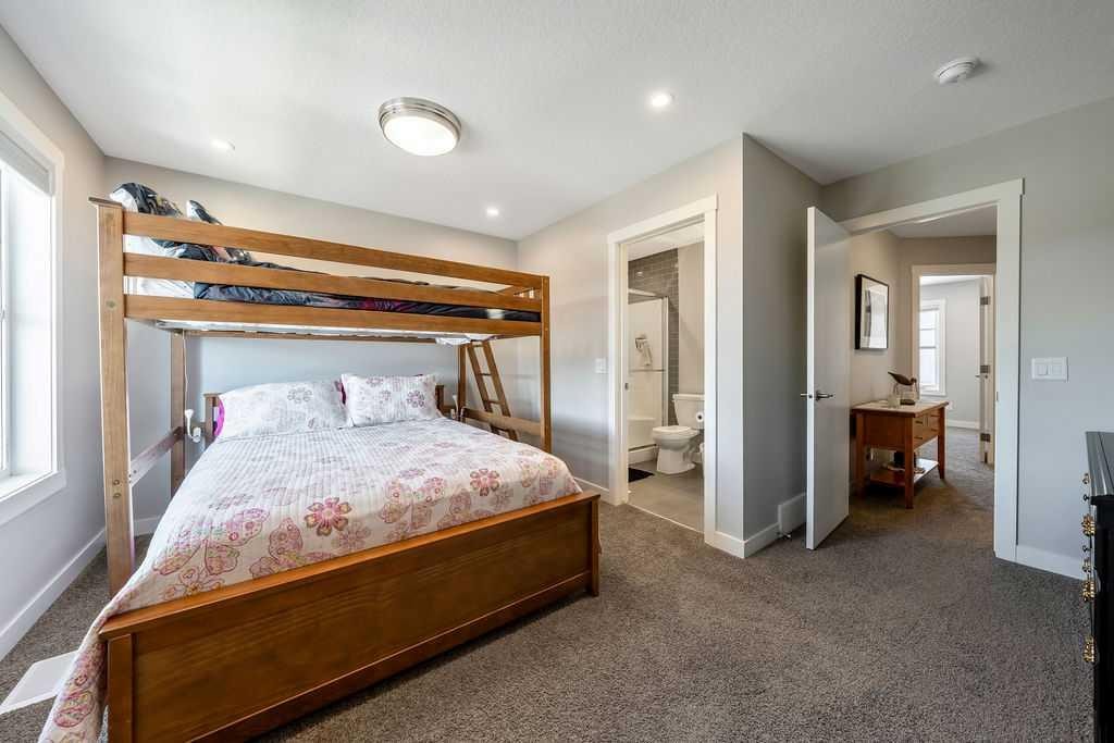 869 Cranston Avenue Se, Calgary, AB - Indoor Photo Showing Bedroom