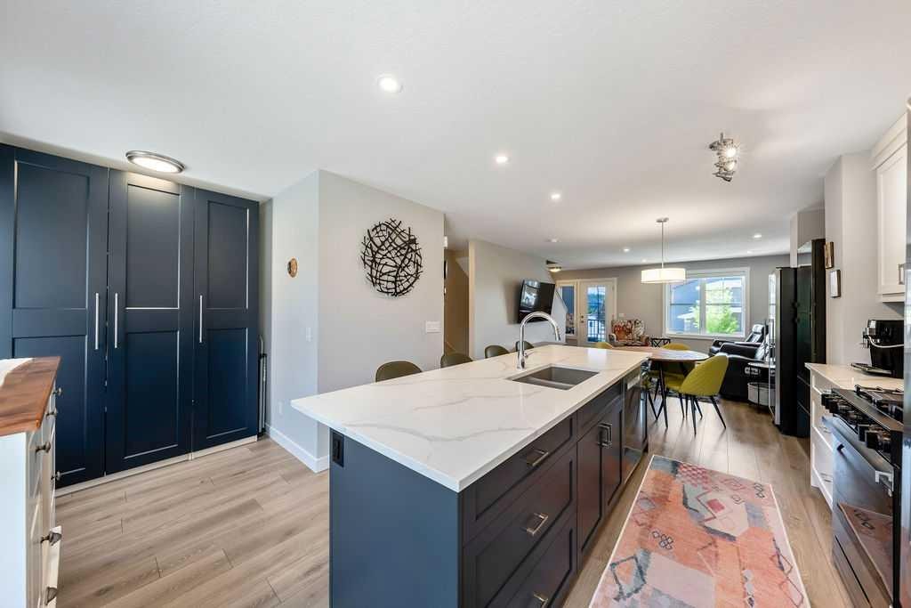 869 Cranston Avenue Se, Calgary, AB - Indoor Photo Showing Kitchen With Double Sink