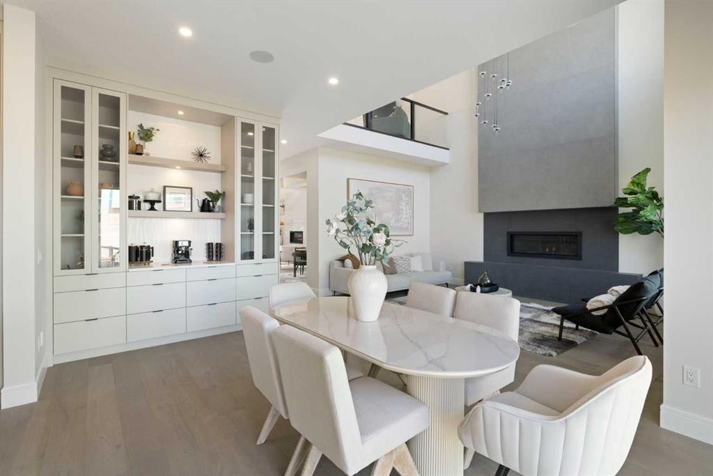 14 Opal Place, Balzac, AB - Indoor Photo Showing Dining Room With Fireplace