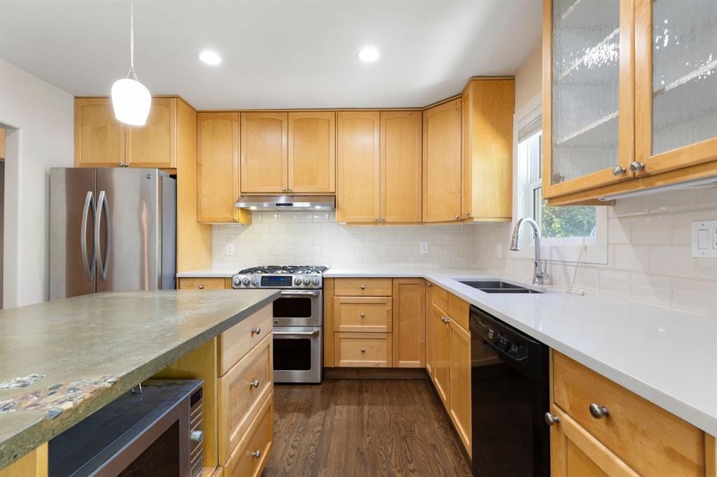 69 Winslow Crescent Sw, Calgary, AB - Indoor Photo Showing Kitchen With Stainless Steel Kitchen With Double Sink With Upgraded Kitchen