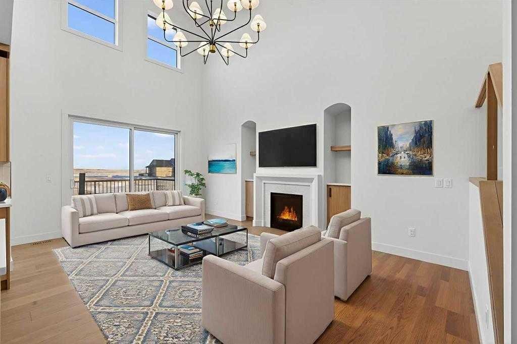 539 Waterford Rise, Chestermere, AB - Indoor Photo Showing Living Room With Fireplace