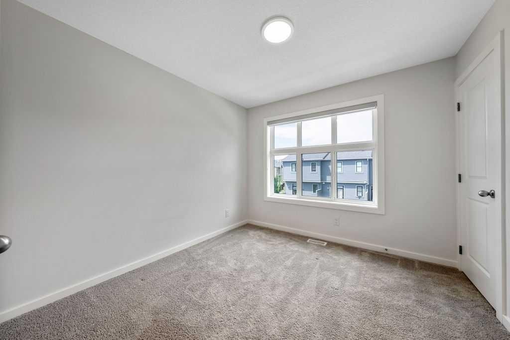 86 Spring Willow Close Sw, Calgary, AB - Indoor Photo Showing Other Room