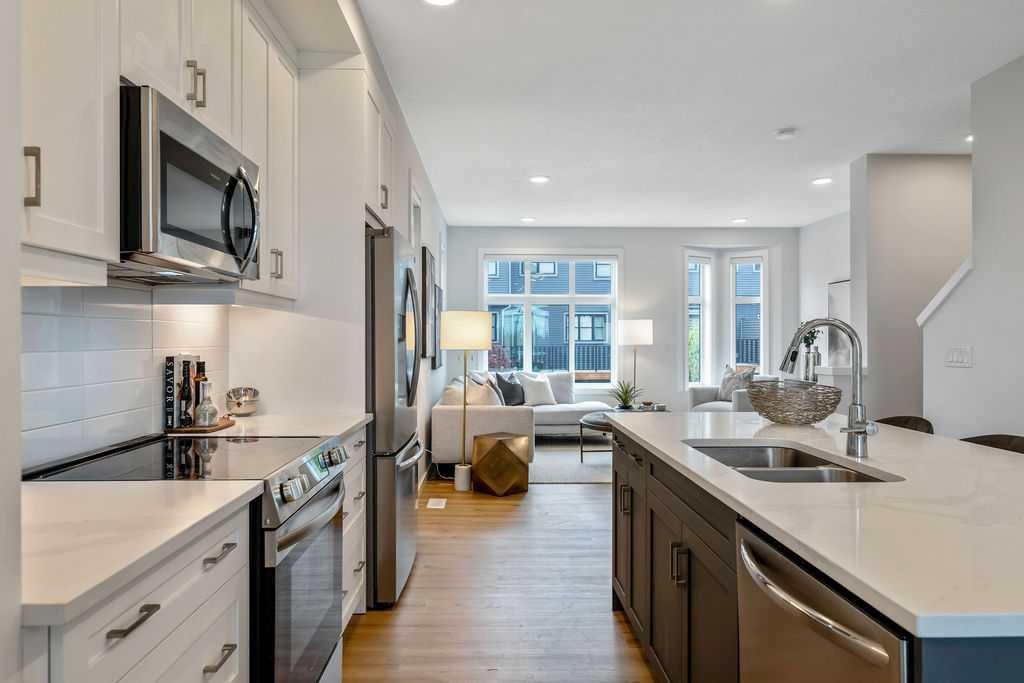 86 Spring Willow Close Sw, Calgary, AB - Indoor Photo Showing Kitchen With Stainless Steel Kitchen With Double Sink With Upgraded Kitchen