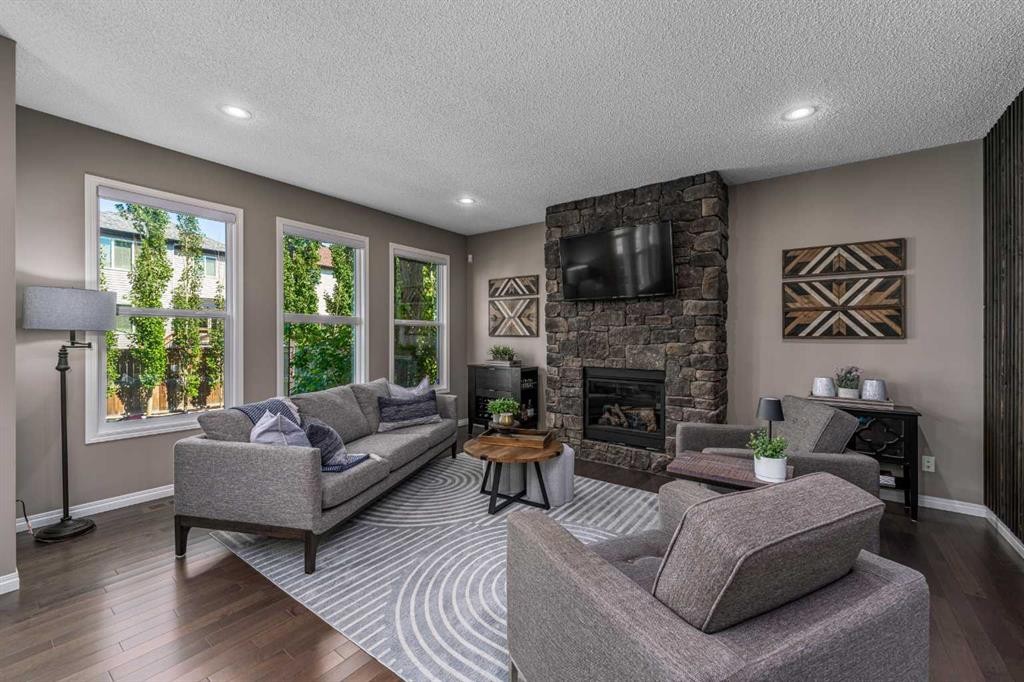 220 Copperpond Green Se, Calgary, AB - Indoor Photo Showing Living Room With Fireplace