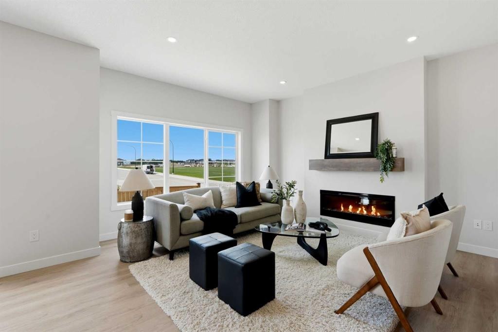 7 Verdure Gate Sw, Calgary, AB - Indoor Photo Showing Living Room With Fireplace