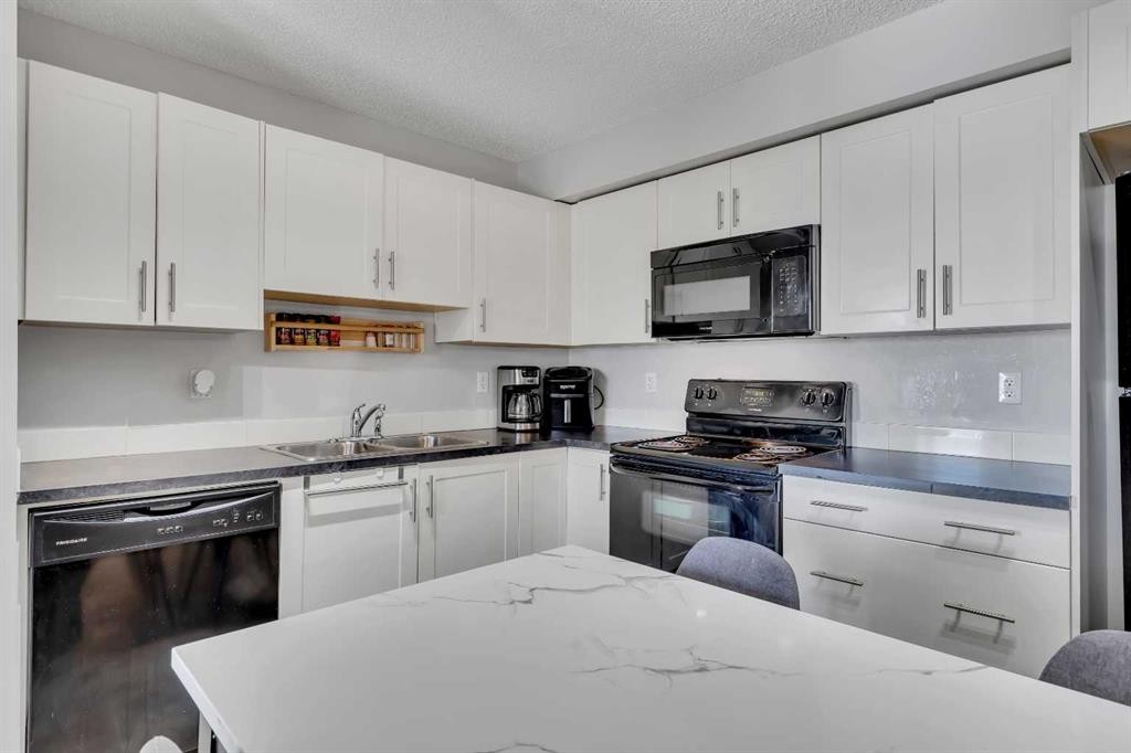 5312-755 Copperpond Boulevard Se, Calgary, AB - Indoor Photo Showing Kitchen With Double Sink