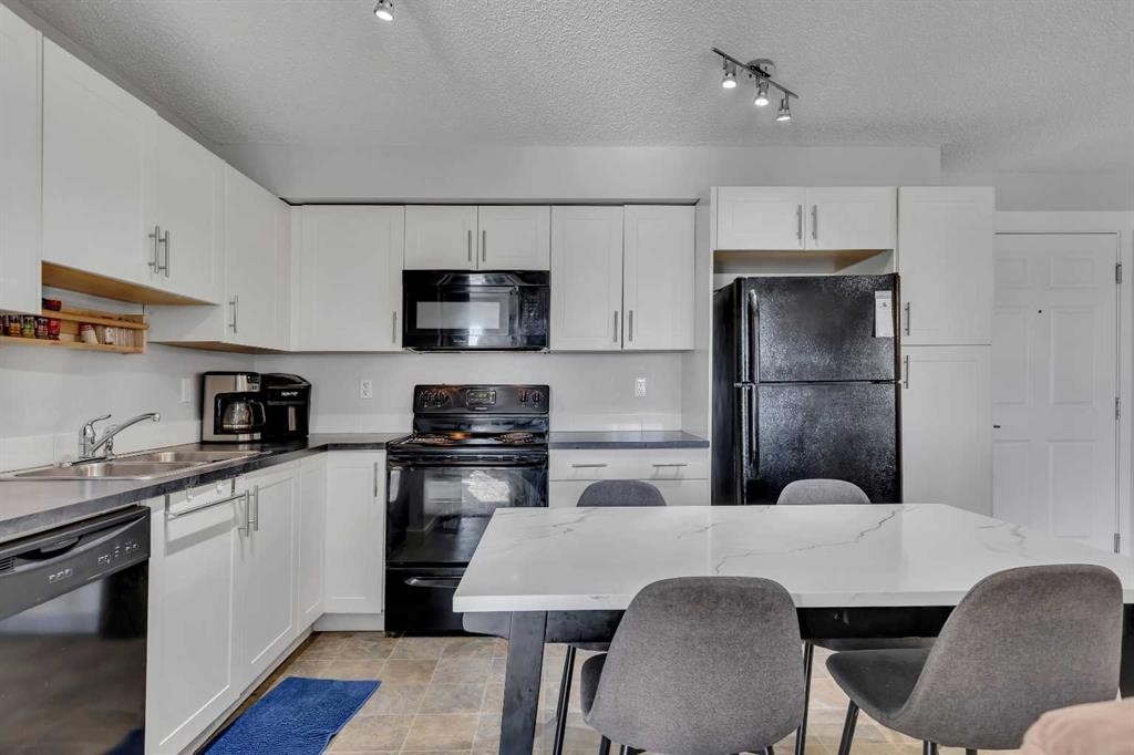 5312-755 Copperpond Boulevard Se, Calgary, AB - Indoor Photo Showing Kitchen With Double Sink