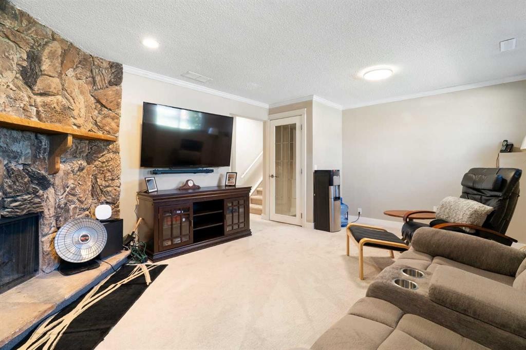 76 Pinebrook Close Ne, Calgary, AB - Indoor Photo Showing Living Room With Fireplace