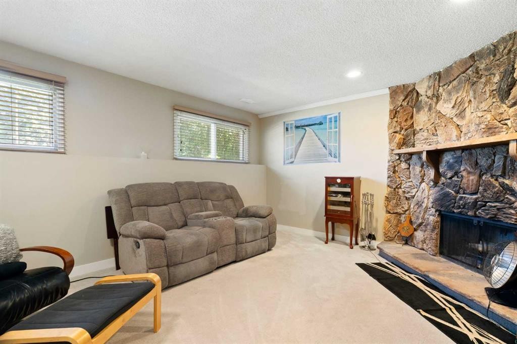 76 Pinebrook Close Ne, Calgary, AB - Indoor Photo Showing Living Room With Fireplace