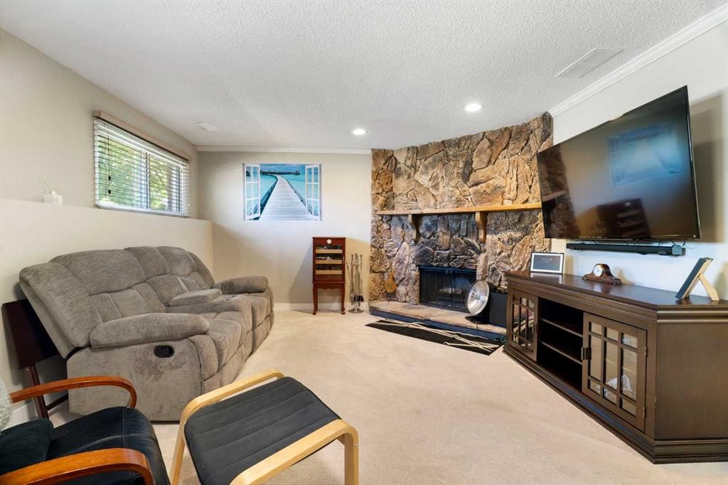 76 Pinebrook Close Ne, Calgary, AB - Indoor Photo Showing Living Room With Fireplace