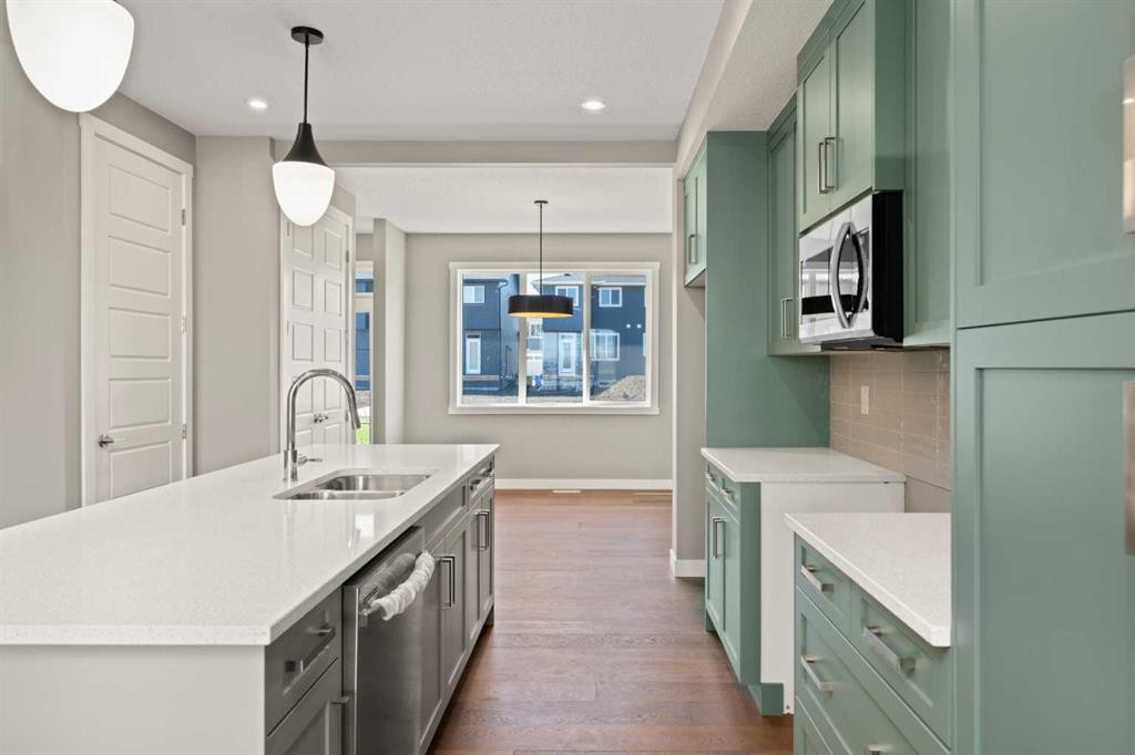 644 Sora Boulevard Se, Calgary, AB - Indoor Photo Showing Kitchen With Double Sink
