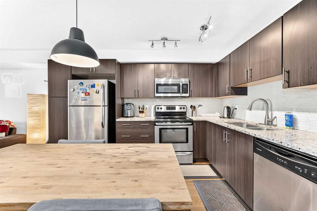 4302-755 Copperpond Boulevard Se, Calgary, AB - Indoor Photo Showing Kitchen With Double Sink With Upgraded Kitchen