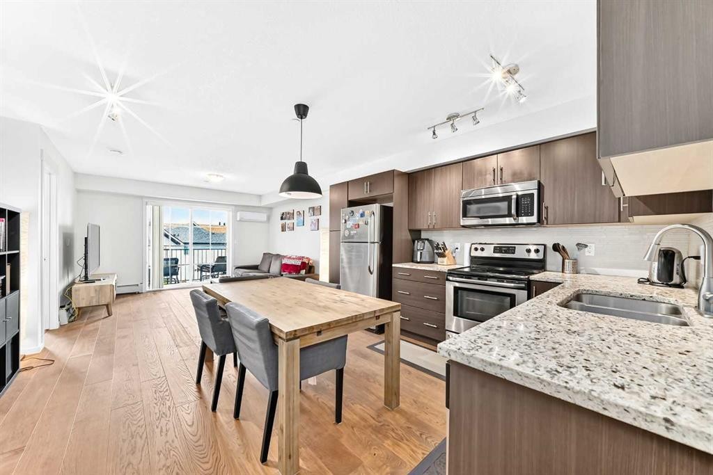 4302-755 Copperpond Boulevard Se, Calgary, AB - Indoor Photo Showing Kitchen With Double Sink With Upgraded Kitchen